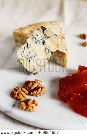Slice Of Blue Aged Stilton Cheese Accompanied With Quince Marmalade Or Jelly Or Jam Spanish Dulce De