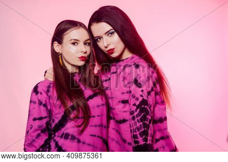2 Girls In The Same Things With Bright Makeup. Brunette Girls, Sisters, Girlfriends, Twins. Women's