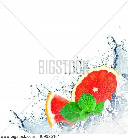 Grapefruit Splash With Water And Ice Cubes Isolated On White Background