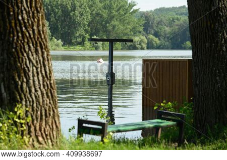 Vadul lui Voda, Criuleni, Moldova, June 2020: Flood caused by river spill after heavy rains set in Vadul lui Voda beach area. Flooded beach cabin, shower and bench