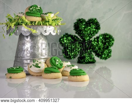 St Patrick's Day Holiday Frosted Sugar Cookies With Green And White Frosting And Sprinkles With Four