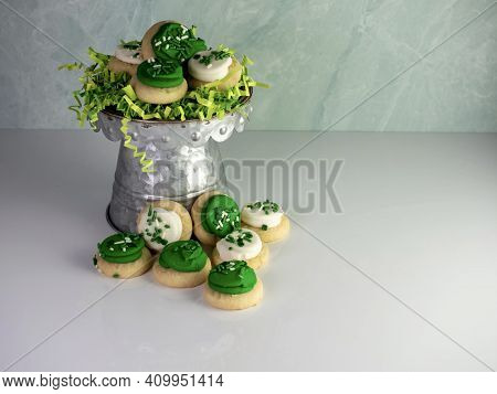 St Patrick's Day Holiday Frosted Sugar Cookies With Green And White Frosting And Sprinkles With Four