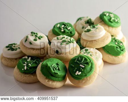 St Patrick's Day Holiday Frosted Sugar Cookies With Green And White Frosting And Sprinkles With Four