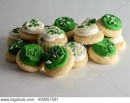 St Patrick's Day Holiday Frosted Sugar Cookies With Green And White Frosting And Sprinkles With Four