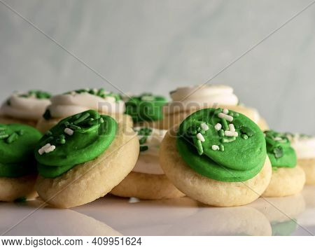St Patrick's Day Holiday Frosted Sugar Cookies With Green And White Frosting And Sprinkles With Four