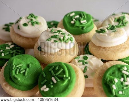 St Patrick's Day Holiday Frosted Sugar Cookies With Green And White Frosting And Sprinkles With Four
