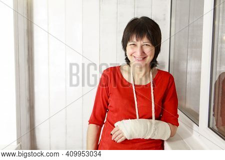 A Broken Arm. Close-up Of The Plaster. A Lady In A Red Jacket With A Bright Manicure. Exercises To R