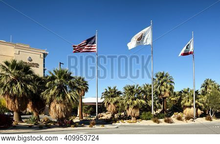 PALM SPRINGS, CA - MARCH 24, 2017: Glags line the entrance road  at the Agua Caliente Casino Resort Spa on Bob Hope Drive.
