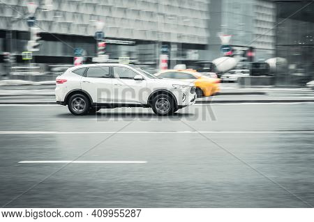 Moscow, Russia - 29.01.2021: Haval F7 In Motion On Winter City Street. Fast Moving White Suv On Wet 