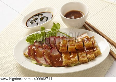 Oriental Roast Pork Belly Or Char Siew With Gravy And Side Dish Sauce In White Plate On White Backgr