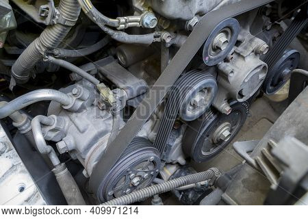 Detail Of The Engine  Fragment Include Ac Compressor Generator Belt And Pulley.