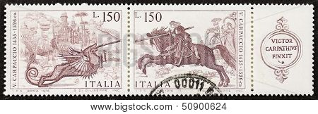 ITALY Ã?ÃÂ¢?? CIRCA 1976: a block of stamps printed in Italy shows St. George Killing the Dragon by Vittore Carpaccio (ca. 1465 Ã?ÃÂ¢?? ca. 1525), famous Venetian painter. Italy, circa 1976