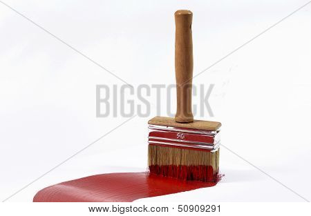 brush and red paint