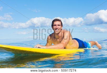 Young Attractive Mann on Stand Up Paddle Board, SUP, in the Blue Waters off Hawaii