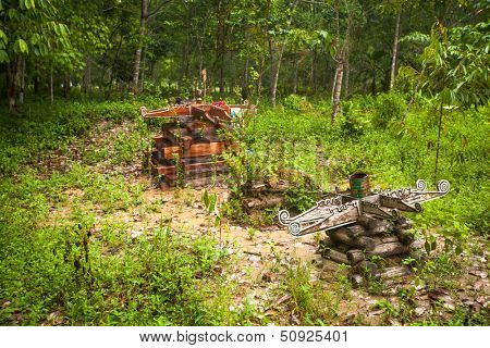 BERDUT, MALAYSIA - APR 8: Cemetery in village Orang Asli in his village on Apr 8, 2013 in Berdut, Malaysia. More than 76% of all Orang Asli live below the poverty line, life expectancy - 53 years old.