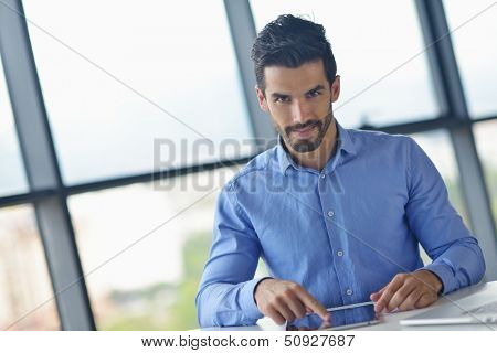 close-up of human hand  business man using tablet compuer at office