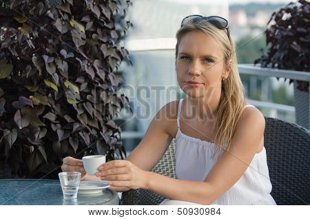 young beautiful woman drinking coffee