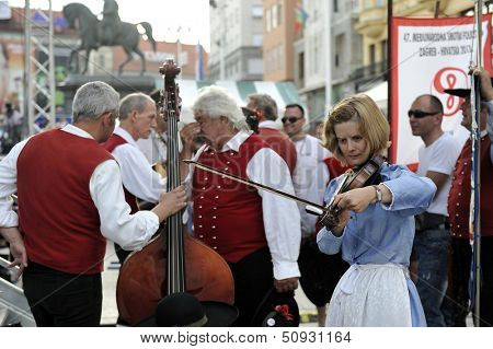 ZAGREB,CROATIA - JULY 19: Members of folk groups Santa Gorizia from Italy during the 47th International Folklore Festival in center of Zagreb,Croatia on July 19,2013