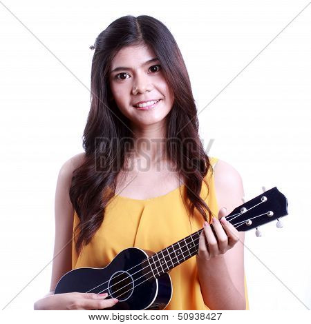 Asian woman playing ukulele