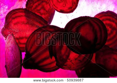 Close up of sliced raw beet in water