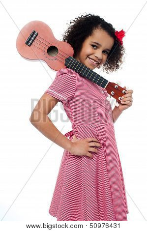 Atttactive School Girl With Toy Guitar