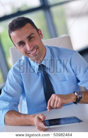 close-up of human hand  business man using tablet compuer at office