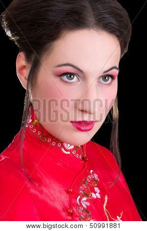 Poortrait Of Young Beautiful Geisha Over Black