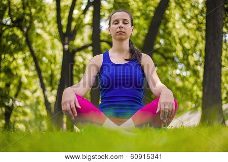 Girl practicing yoga and meditation