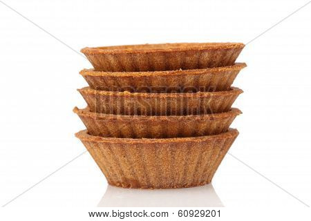 Stack Of Empty Dark Tartlets