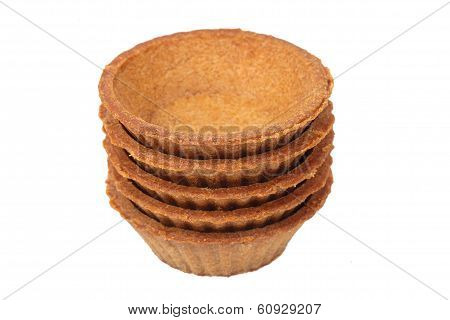 Stack Of Empty Dark Tartlets