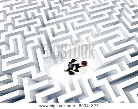 businessman with notebook and 3d maze