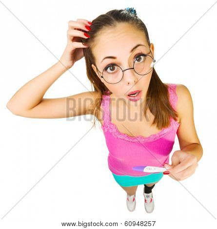 Funny schoolgirl in nerd glasses with positive pregnacy test isolated
