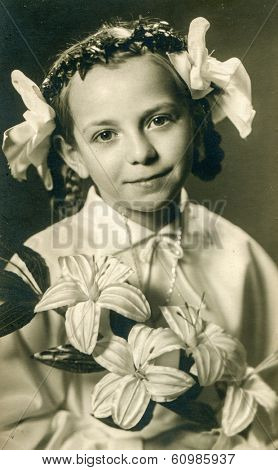OSTROW, POLAND, SEVENTIES - Vintage photo of little girl at her First Communion