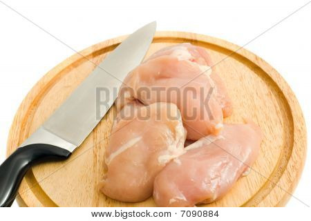 เนื้อไก่และมีดบน Hardboard แยกต่างหาก