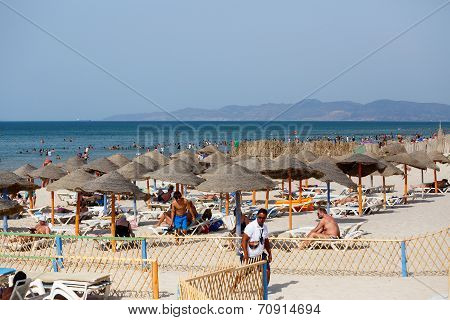 People Relaxing At Private Sandy Tunisian Beach