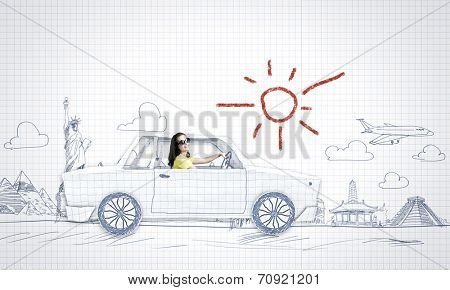 Young woman riding car made of list of paper