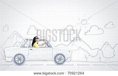 Young woman riding car made of list of paper