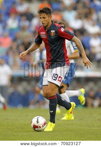 BARCELONA - AUG, 17: Leandro Greco of Genoa CFC in action during a friendly match against RCD Espanyol at the Estadi Cornella on August 17, 2014 in Barcelona, Spain