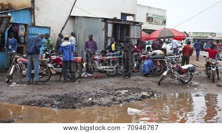 JUBA, SOUTH SUDAN-JUNE 22 2012: Unidentified motorcycle taxi drivers wait for riders in Juba, capital of South Sudan