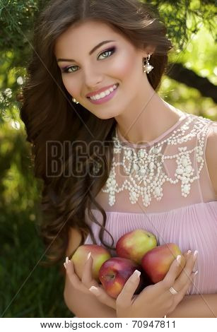 Portrait of beautiful young woman with makeup in fashion clothes on hature