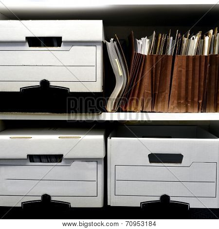 Office shelves full of files and boxes