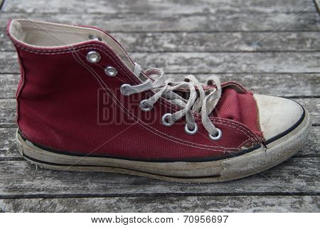 Old red canvas shoe