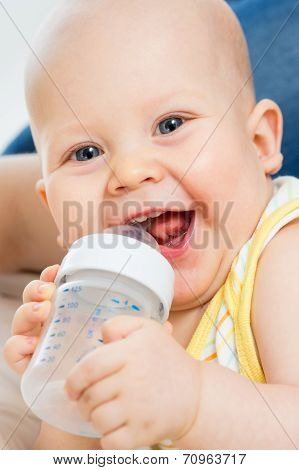 Pretty Baby Boy Drinking Water From Bottle