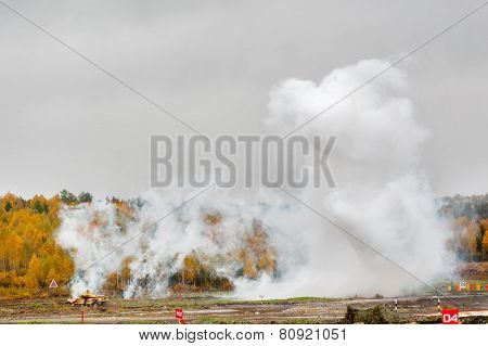 Russian tank T-90 hides in smoke screen from enemy