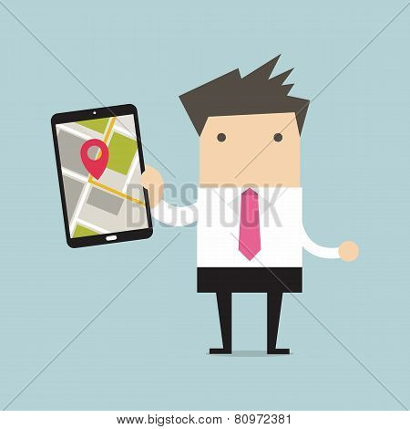 Businessman holding tablet computer with navigation map and pin pointer on the screen
