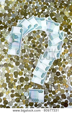 The question mark laid out banknotes on the background of the coins