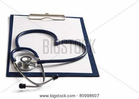 A blue statoscope in the shape of a heart on a file
