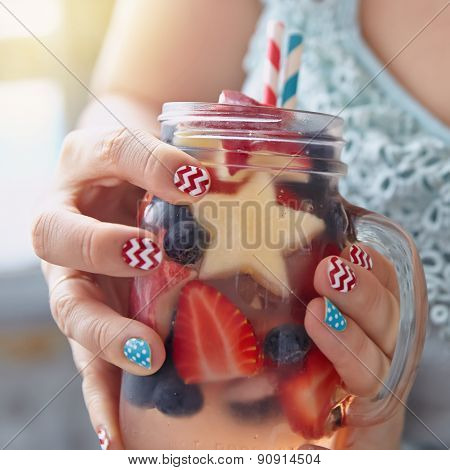 Cocktail with strawberry, blueberry and apple