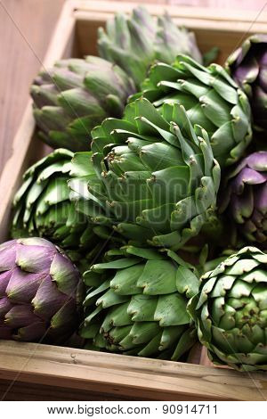 artichokes in wooden box