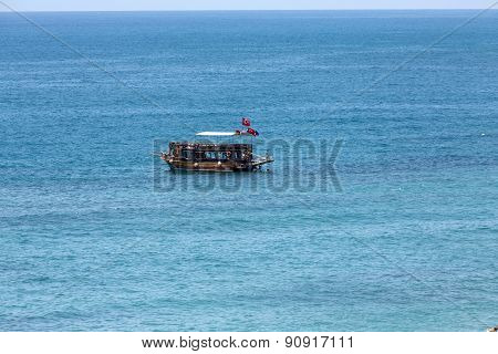 Tourists enjoying sea journey on vintage sailships in Alanya Turkey.
